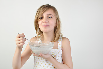 Image showing child with a bowl of milk porridge