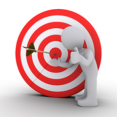 Image showing Person satisfied is showing an arrow in the center of target