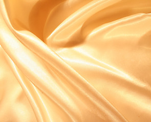 Image showing Smooth elegant gold satin as background