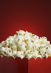 Image showing Box of popcorn and red background