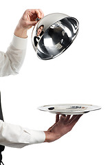 Image showing hands of waiter with cloche lid cover