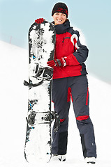 Image showing Happy woman with snowboard