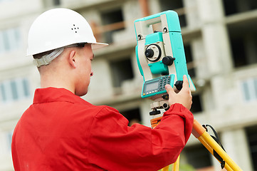 Image showing surveyor works with theodolite