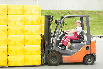 Image showing worker driver at warehouse forklift loader works