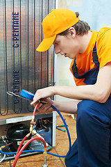 Image showing repair work on fridge appliance