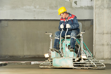 Image showing Worker trowelling and finishing of concrete