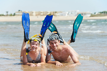 Image showing active couple at sea beach with snorkel  set