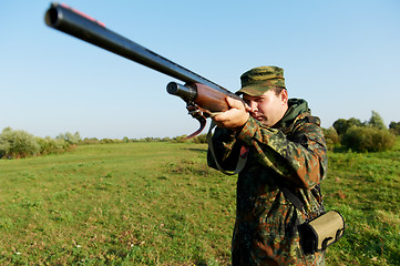 Image showing hunter with rifle gun