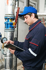 Image showing heating engineer repairman in boiler room