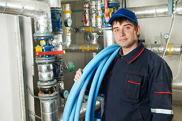 Image showing heating engineer repairman in boiler room