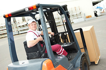 Image showing warehouse worker driver in forklift