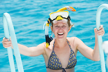 Image showing smiling woman with snorkel equipment