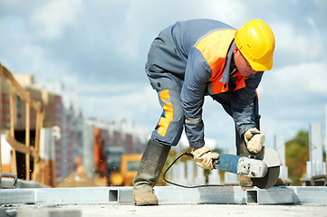 Image showing builder working with cutting grinder