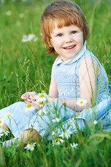 Image showing child girl with chamomile daisy