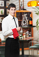 Image showing waiter in uniform at restaurant