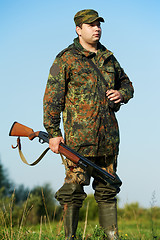 Image showing hunter with rifle gun