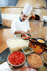 Image showing Arab baker chef making Pizza