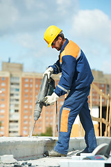 Image showing portrait of construction worker with perforator