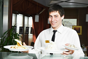 Image showing waiter in uniform at restaurant