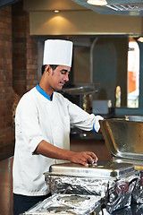 Image showing chef boiling a soup