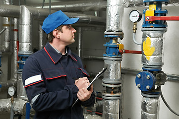 Image showing heating engineer repairman in boiler room