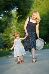 Image showing mother and child walking outdoors