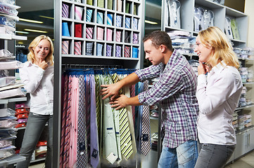 Image showing Young couple at clothes shopping