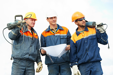 Image showing construction workers with power tools