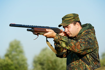 Image showing hunter with rifle gun