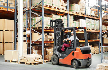 Image showing worker driver at warehouse forklift loader works