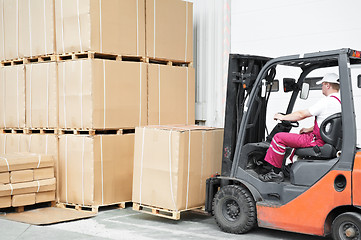 Image showing worker driver at warehouse forklift loader works