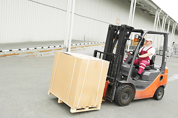 Image showing warehouse worker driver in forklift