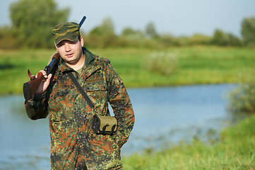 Image showing hunter with rifle gun