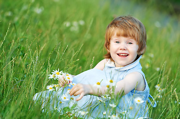 Image showing child girl with chamomile daisy