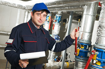 Image showing heating engineer repairman in boiler room