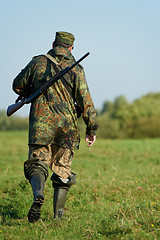 Image showing hunter with rifle gun