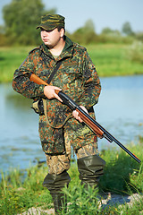 Image showing hunter with rifle gun