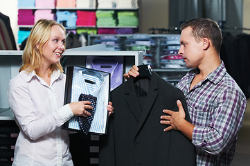 Image showing Young couple at clothes shopping