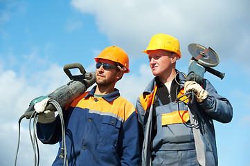 Image showing construction workers with power tools