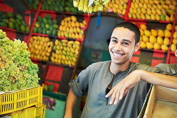 Image showing arab youth invites to purchase fruits