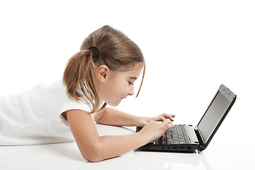 Image showing Little student girl with a laptop