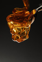 Image showing Honey pouring