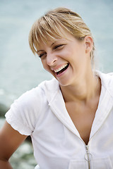 Image showing smiling woman by the sea