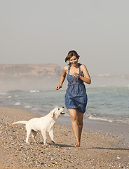 Image showing Girl with her dog