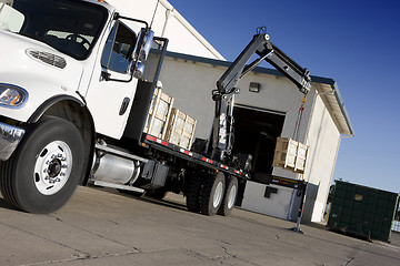 Image showing crane delivering box