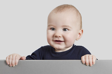 Image showing young child holding sign