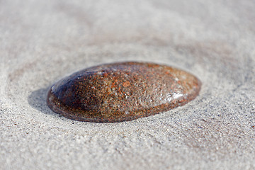 Image showing single stone in sandy ground