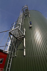 Image showing Industrial zone, Steel pipelines and tanks against blue sky