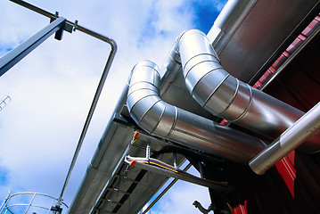 Image showing Industrial zone, Steel pipelines and tanks against blue sky