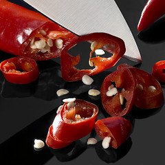 Image showing sliced chillies and blade